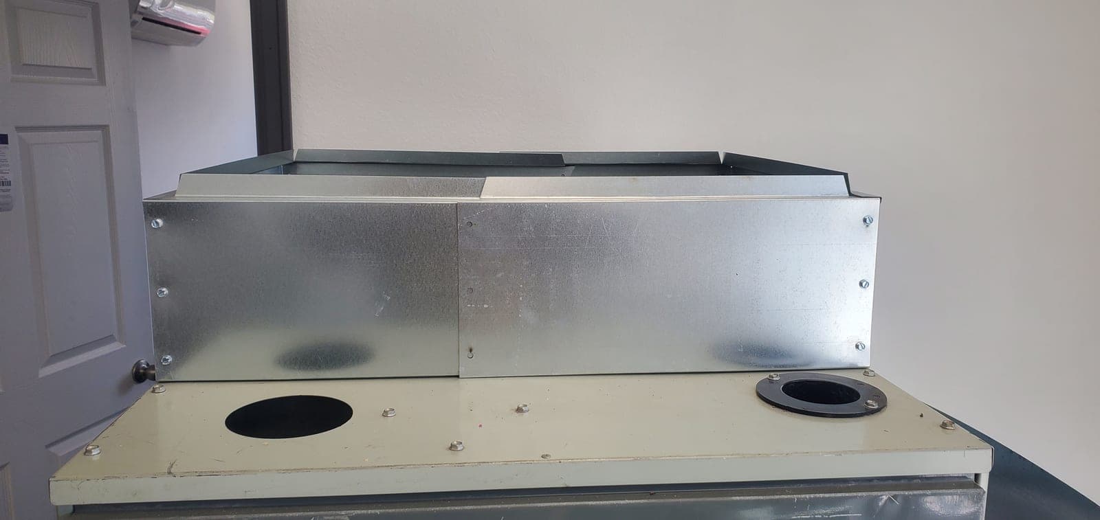 Coil transition (coil spacer), galvanized steel, on a white background